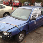 Broken down blue car